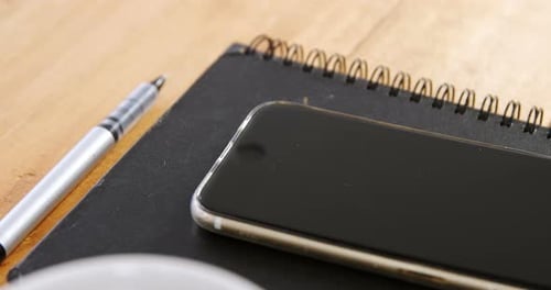 Cup of Coffee with Phone and Notebook Still Life