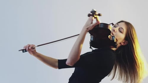 Female Violinist Plays and Kisses Her Violin