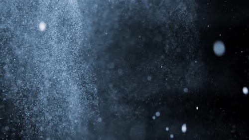 Abstract Particles Floating on Black Background