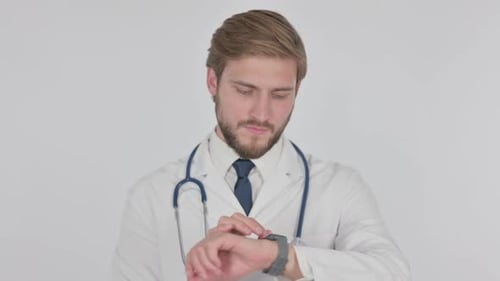 Young Doctor Using Smartwatch on White Background