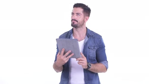 Happy Man Uses Digital Tablet on White Background