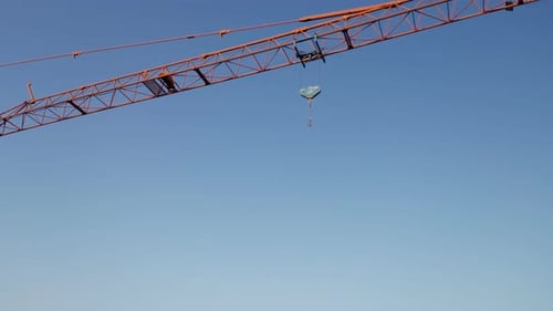 Orange Crane Isolated Blue Sky