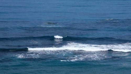 Water Surface Of Blue Sea With Small Waves