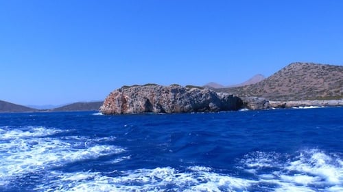 Island View from Boat in Blue Ocean Water