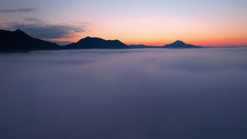 4K Sun is rising above sea of clouds until the horizon