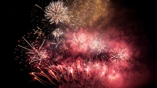 Dynamic Fireworks Exploding in the Dark Night Sky