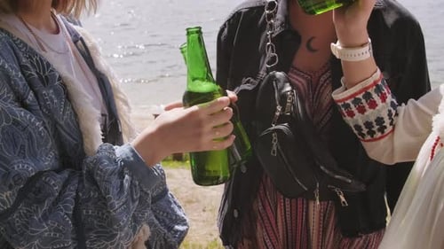 Sipping Drinks At Lake Shore