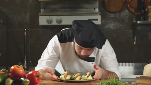 Chef Arranges Fried Chicken Dish in Kitchen