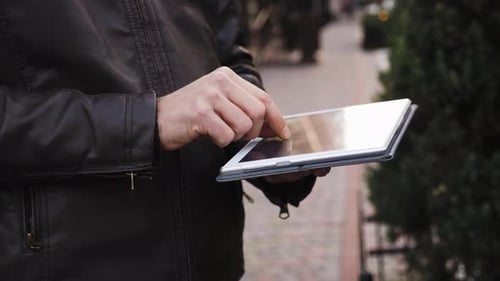 Close-up Man's Hands Use Tablet Computer Outdoor, Man Makes Online Purchases, Surf Internet