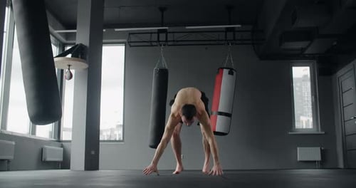Athlete Performs Burpees Exercises at the Gym in Slow Motion Push Ups and Jumping Crossfit and Power