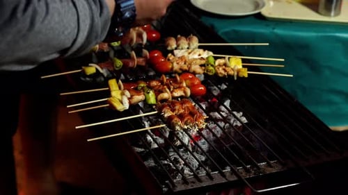 grilling barbecue pork stick in street market