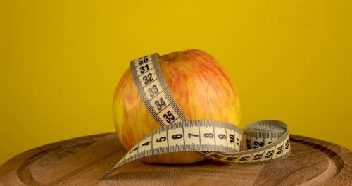 Apple Wrapped With Measuring Tape for Health