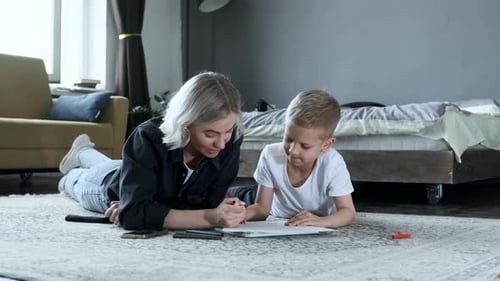 Mother and Child Drawing Together at Home