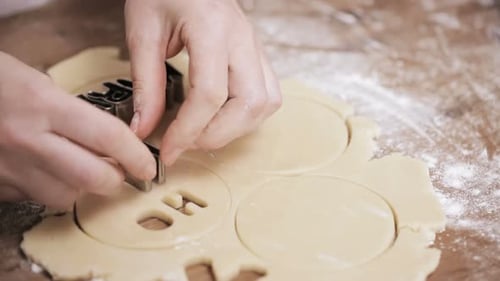 Festive Holiday Cookies Being Prepared By Hand