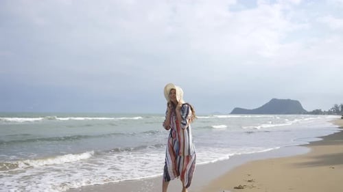 4K Portrait of Beautiful Caucasian woman walking on tropical beach in summer sunny day