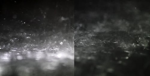 Close Up of Heavy Rain on Dark Surface