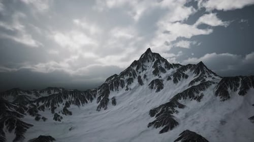 Aerial Flyover Majestic Snow Mountains and Cloudy Sky