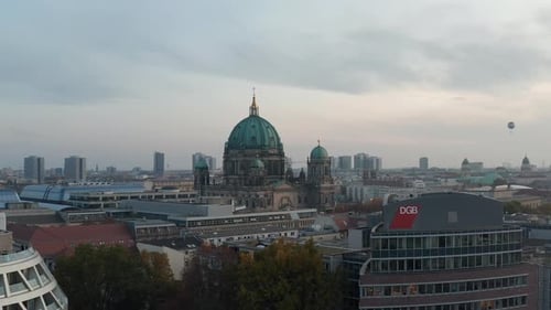 Forwards Flying Over Various Buildings Near Historic Valuable Landmark Berlin Cathedral
