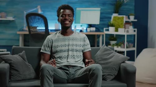 POV of Person Smiling and Sitting on Couch