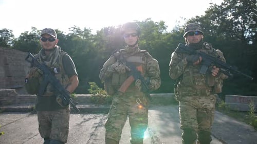 Infantrymen with Weapons Moving, Patrolling Area