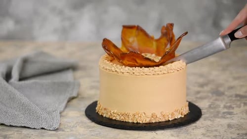 Cutting into Caramel Cake with Knife