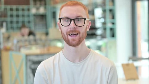 Man Smiling and Laughing at Camera