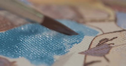 Close-Up of a Brush Painting with Blue Paint