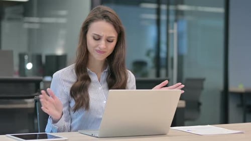 Young Businesswoman Feeling Angry While using Laptop