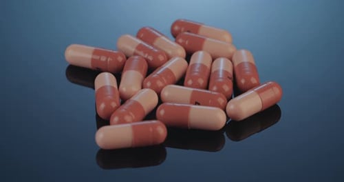 Pile of Two-Tone Medicine Capsules Rotating