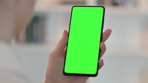 Rear View of Woman Using Smartphone with Chroma Key Screen