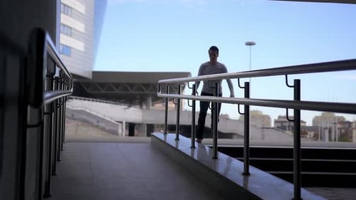 Young Adult Performing Urban Parkour Stunts