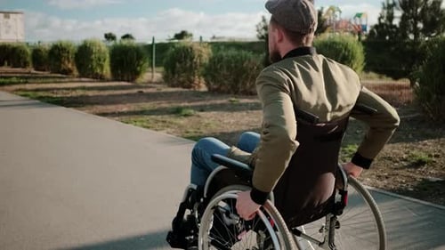 Disabled Man on Walk in the Town