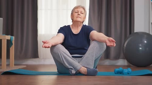 Senior Woman Practicing Yoga at Home