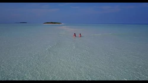 Man and lady tan on tranquil coast beach wildlife by blue sea and white sandy background of the Mald