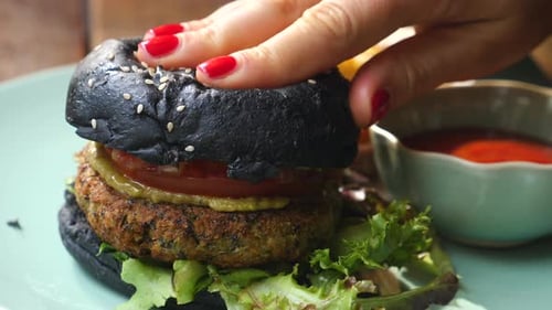 Appetizing Close Up of Vegan Burger with Black Bun
