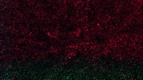 Red and Green Christmas Glitter Particle Background Loop
