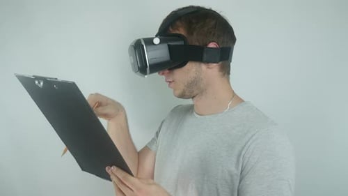 Man Drawing in Virtual Reality with VR Headset