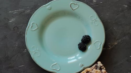 Slice of Blueberry Crumble on a Plate