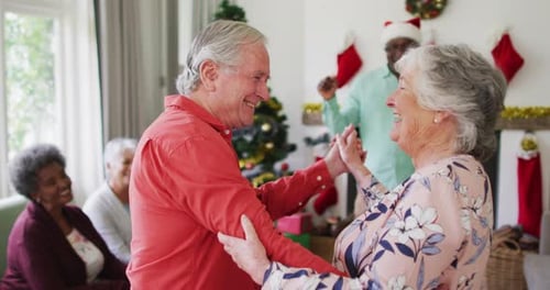 Seniors Dancing Together at Christmas