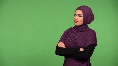 A Young Beautiful Muslim Woman is Angry Green Screen Background