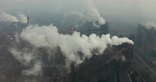 Aerial View. Emission To Atmosphere From Industrial Pipes. Smokestack Pipes Shooted with Drone