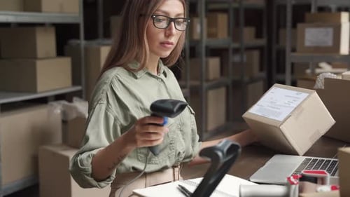Female Seller Checking Ecommerce Parcel Order in Dropshipping Warehouse