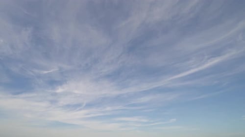 Blue Sky with Soft White Clouds Aerial
