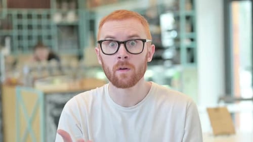 Man Speaking with Exaggerated Hand Gestures