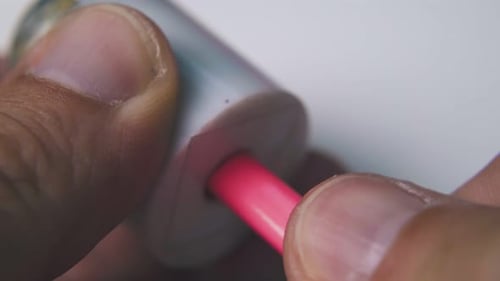 Man Turns Pink Pencil Holding Sharpener Extreme Close View