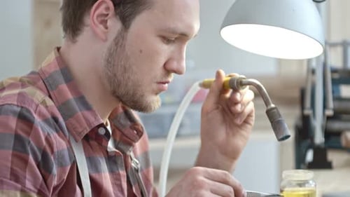 Jeweler Working on Silver Ring