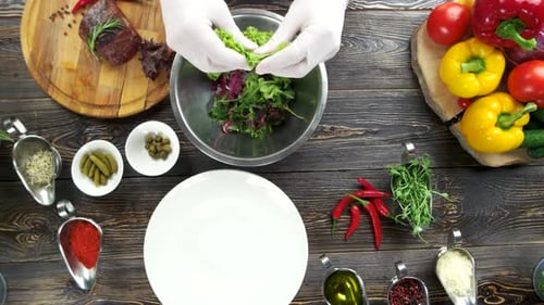 Salad Preparation with Fresh Vegetables and Ingredients