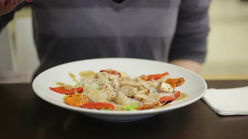 Young Lady Eating Appetizing Chicken and Vegetable Salad, Keeping Healthy Diet