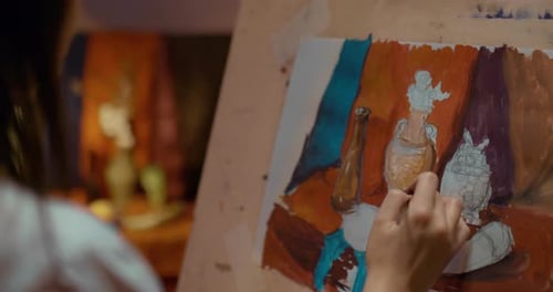 Art Studio Artist Paints a Still Life Dim Lighting