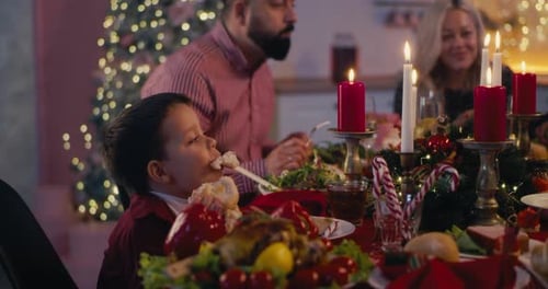Boy on Christmas Dinner with Family